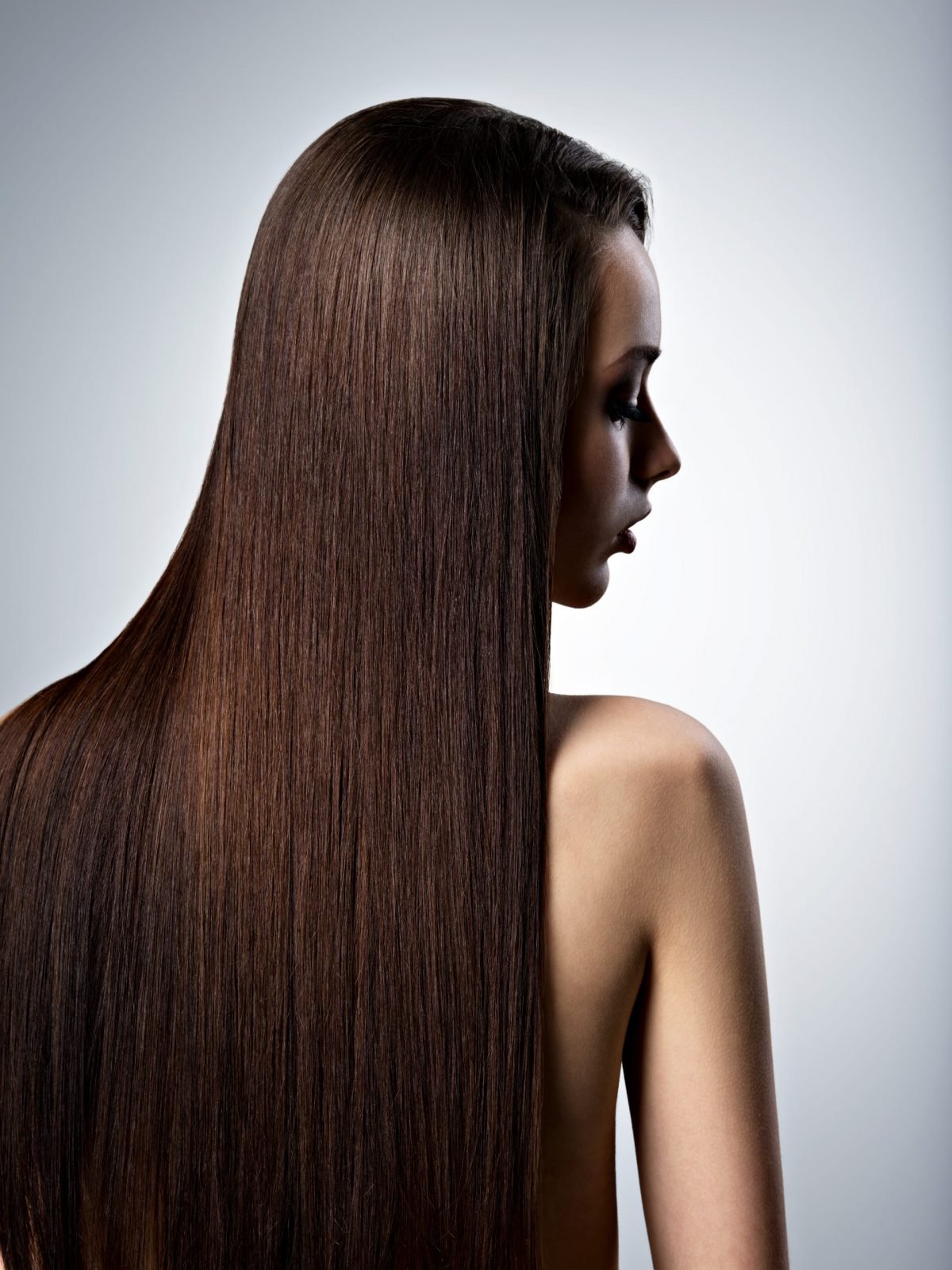 Portrait of beautiful woman with long straight brown hair